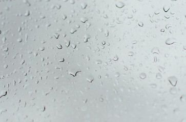 Water droplets on the window and some out of focus. Background.
 - obrazy, fototapety, plakaty