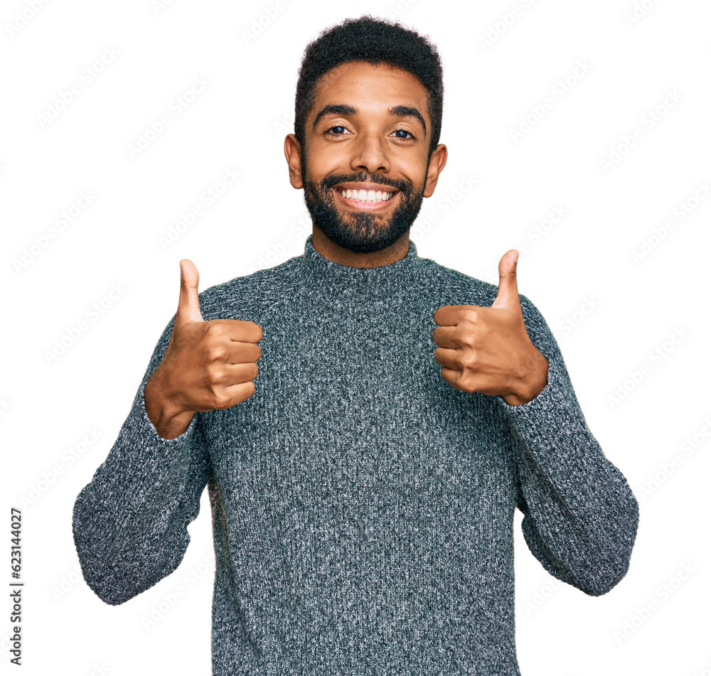 Canvas Prints young african american man wearing casual clothes success sign doing positive gesture with hand, thu