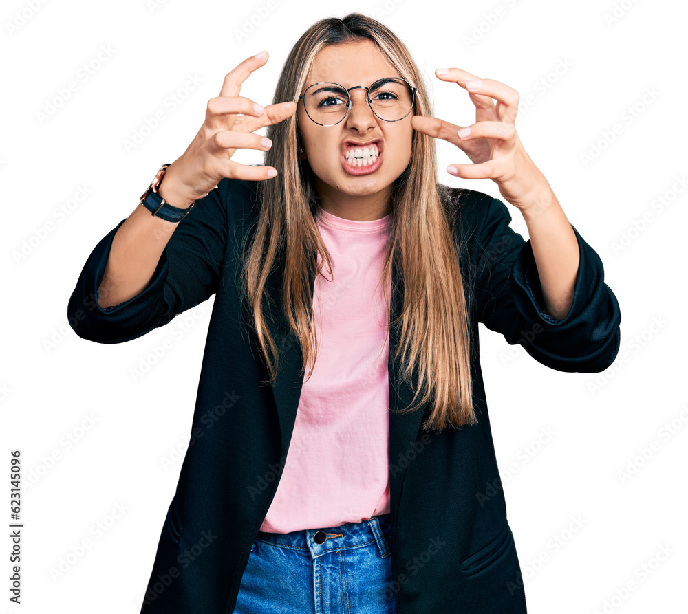 Sticker hispanic young woman wearing business jacket and glasses shouting frustrated with rage, hands trying