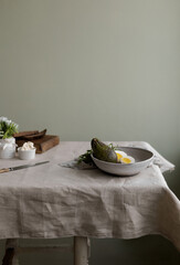Healthy and delicious food for the breakfast - a green avocado, eggs and fresh herbs in a bowl,...