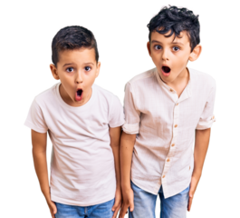 Couple of little brothers together wearing casual clothes scared and amazed with open mouth for surprise, disbelief face