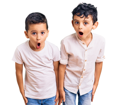 Couple of little brothers together wearing casual clothes scared and amazed with open mouth for surprise, disbelief face - Powered by Adobe