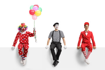 Clown, mime and an entertainer sitting on a white banner