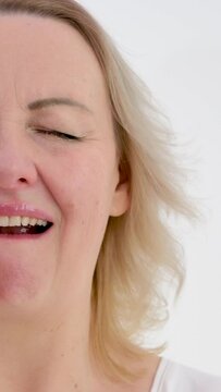vertical video psychosomatics unwillingness to speak sore throat lump in throat unpleasant emotions negative facial expression raise eyes up tighten face open mouth slightly touch neck