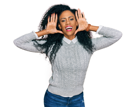Middle age african american woman wearing casual clothes smiling cheerful playing peek a boo with hands showing face. surprised and exited