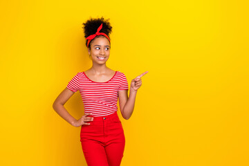 Photo of cute dreamy lady wear striped red t-shirt looking showing finger empty space isolated yellow color background