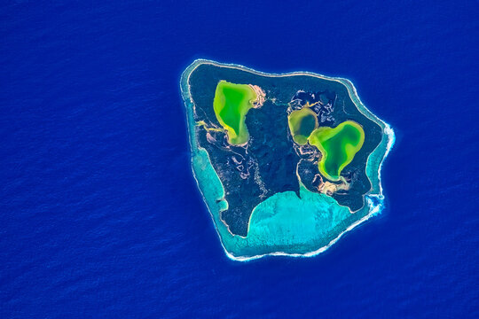 Aerial view of the Maiao Atoll, Polynesia. Digital Enhancement. Elements by NASA