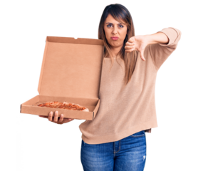 Young beautiful woman holding delivery cardboard box with pizza with angry face, negative sign showing dislike with thumbs down, rejection concept