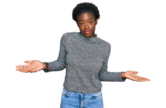 Young african american girl wearing casual clothes clueless and confused expression with arms and hands raised. doubt concept.