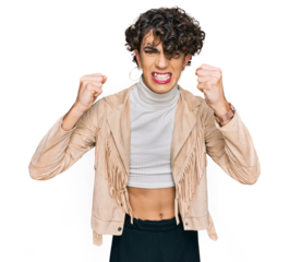 Handsome man wearing make up and woman clothes angry and mad raising fists frustrated and furious while shouting with anger. rage and aggressive concept.