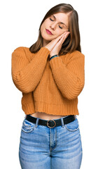 Beautiful caucasian woman wearing casual clothes sleeping tired dreaming and posing with hands together while smiling with closed eyes.