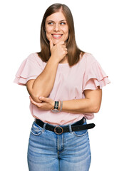 Beautiful caucasian woman wearing casual clothes with hand on chin thinking about question, pensive expression. smiling with thoughtful face. doubt concept.