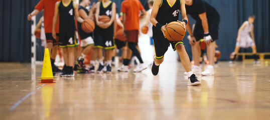 Youth Basketball Players in a Team on Training Drill. Young Boys Practice Basketball With Young Coach. Basketball Training Unit For Youth Players