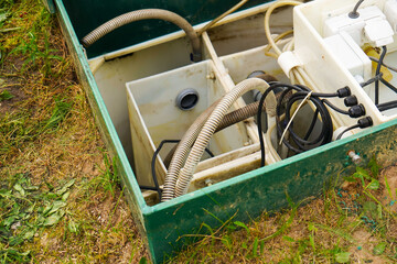 Private drainage systems. water sewer system. The green tin case is open for cleaning and...