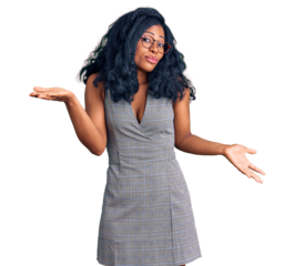 Beautiful african american woman wearing business dress and glasses clueless and confused expression with arms and hands raised. doubt concept.