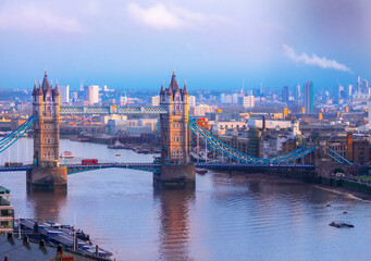 Fototapeta na wymiar The famous historical Tower Bridge over the River Thames in the city of London at sunset in London