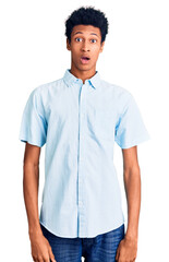 Young african american man wearing casual clothes afraid and shocked with surprise and amazed expression, fear and excited face.