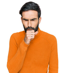 Young hispanic man wearing casual clothes feeling unwell and coughing as symptom for cold or bronchitis. health care concept.