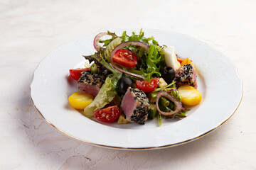 Salad with tuna and tomatoes.