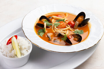 Traditional tom yum soup. On a light background.