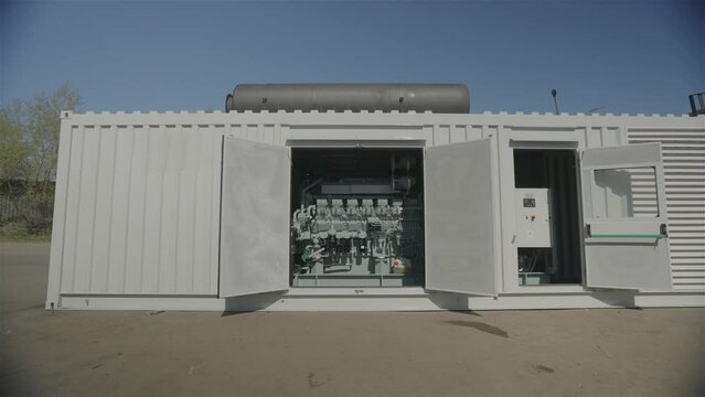 Exterior of a large industrial generator. Mobile diesel generator. Diesel industrial power generator generator. Container Mobile Intelligent Diesel Generator Energy Storage Power Station. 