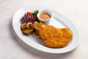 Deep fried turkey leg in a plate.