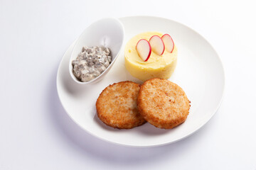 Cutlets and mashed potatoes in a plate.