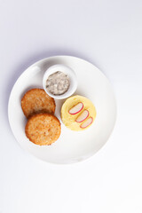 Cutlets and mashed potatoes in a plate.