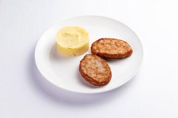 Cutlets and mashed potatoes in a plate.