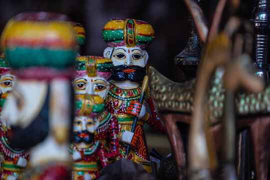 Wooden art, Handmade colorful wooden souvenir of rajasthani male at pushkar shop.