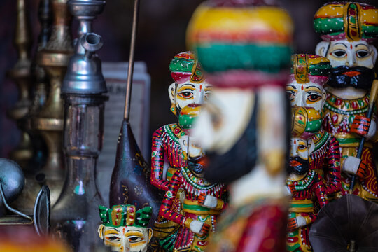 Wooden art, Handmade colorful wooden souvenir of rajasthani male at pushkar shop.