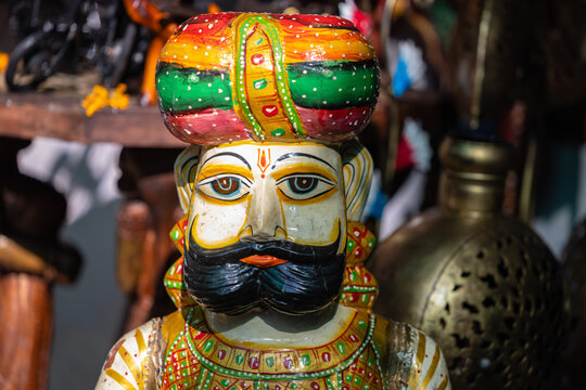 Wooden art, Handmade colorful wooden souvenir of rajasthani male at pushkar shop.