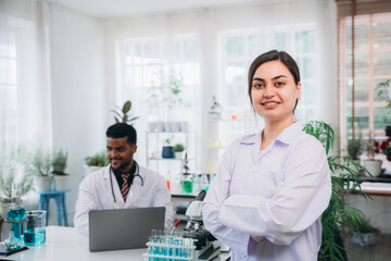 Portrait of Scientist and Pharmacist Conducting Chemical Research Testing in a Laboratory. Laboratory Experiments. Researchers working, preparing and analyzing. Biotechnology Research.