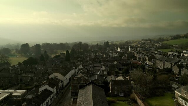 Behold the dramatic allure of the rural Cumbrian countryside through captivating drone footage, capturing the small English town of Sedbergh on the edge of the Yorkshire Dales