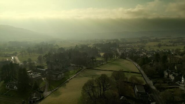 Behold the dramatic allure of the rural Cumbrian countryside through captivating drone footage, capturing the small English town of Sedbergh on the edge of the Yorkshire Dales