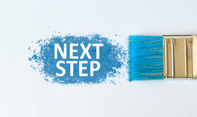 Next Step text on blue paint with brush on white background