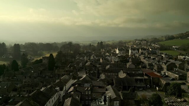 Behold the dramatic allure of the rural Cumbrian countryside through captivating drone footage, capturing the small English town of Sedbergh on the edge of the Yorkshire Dales