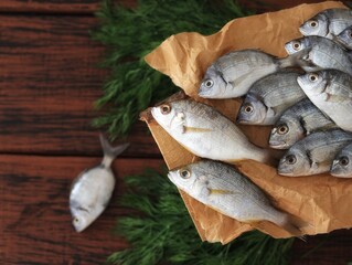 Laskyr, or Sea crucian carp - fish of the spawning family, Diplodus sargus sargus, spawn, also golden spawn, bream, on the table, top view, background image