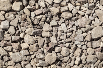 Granite stone chips. Small rubble, building material rock, gravel texture