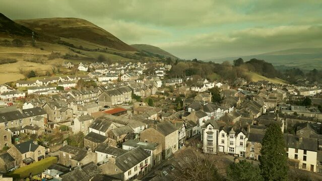 Behold the dramatic allure of the rural Cumbrian countryside through captivating drone footage, capturing the small English town of Sedbergh on the edge of the Yorkshire Dales