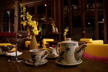 Beautiful ceramic tea set on a table of a evening tea lounge