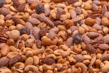 A group of almonds, pistachios, walnuts, macadamia, cashews.