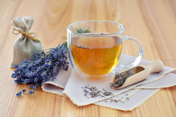 Fresh delicious tea with lavender and lavender flowers on a wooden table