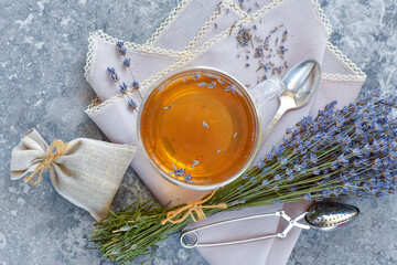 Bunch of lavender flowers, sachet filled with dried lavender and healthy tea. Top view. Flat lay. - 623184240