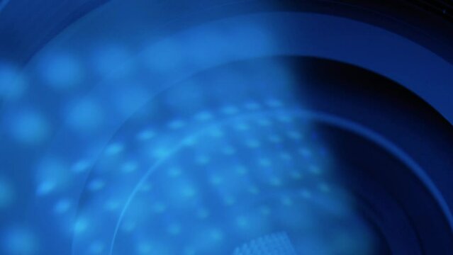Camera lens with lens reflections on blur. Media and technology concept background.