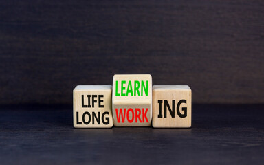 Lifelong learning working symbol. Concept word Lifelong learning working on block on a beautiful...