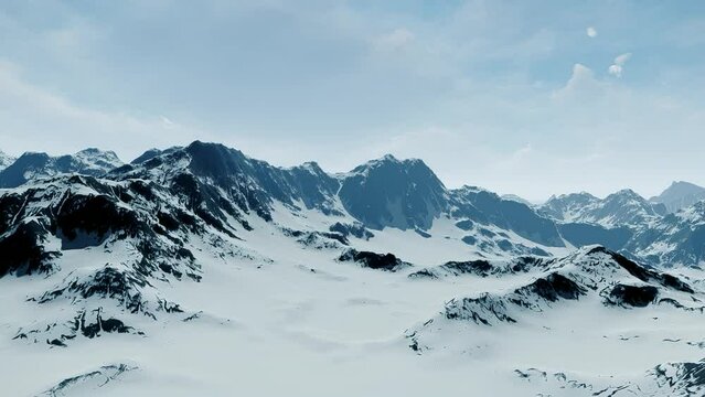 Flight Over the Majestic Mountains Covered With Snow. The Sun's Rays do not Break Through the Foggy Sky.