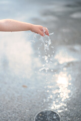 boy's hand and water