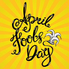 Obraz premium 1 April Fools'day hand lettering card. Vector calligraphy text with jester hat on yellow background.