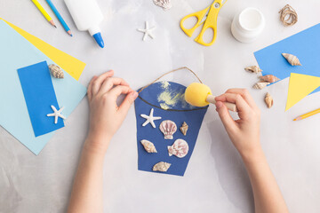 Paper bucket of shells summer idea for kids craft in kindergarten hands ocean's day